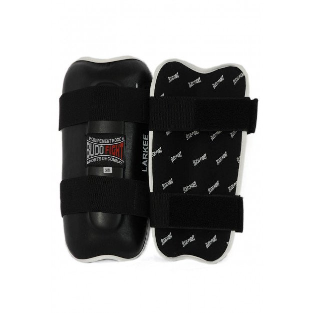 Protege-tibia rigide