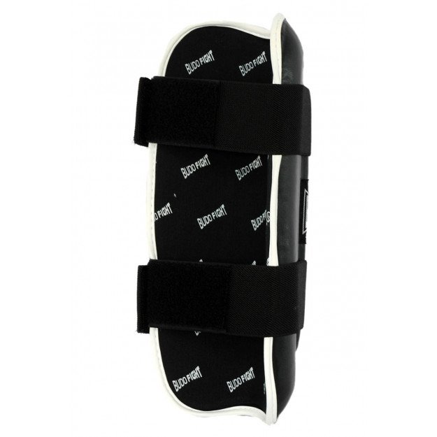 Protege-tibia rigide